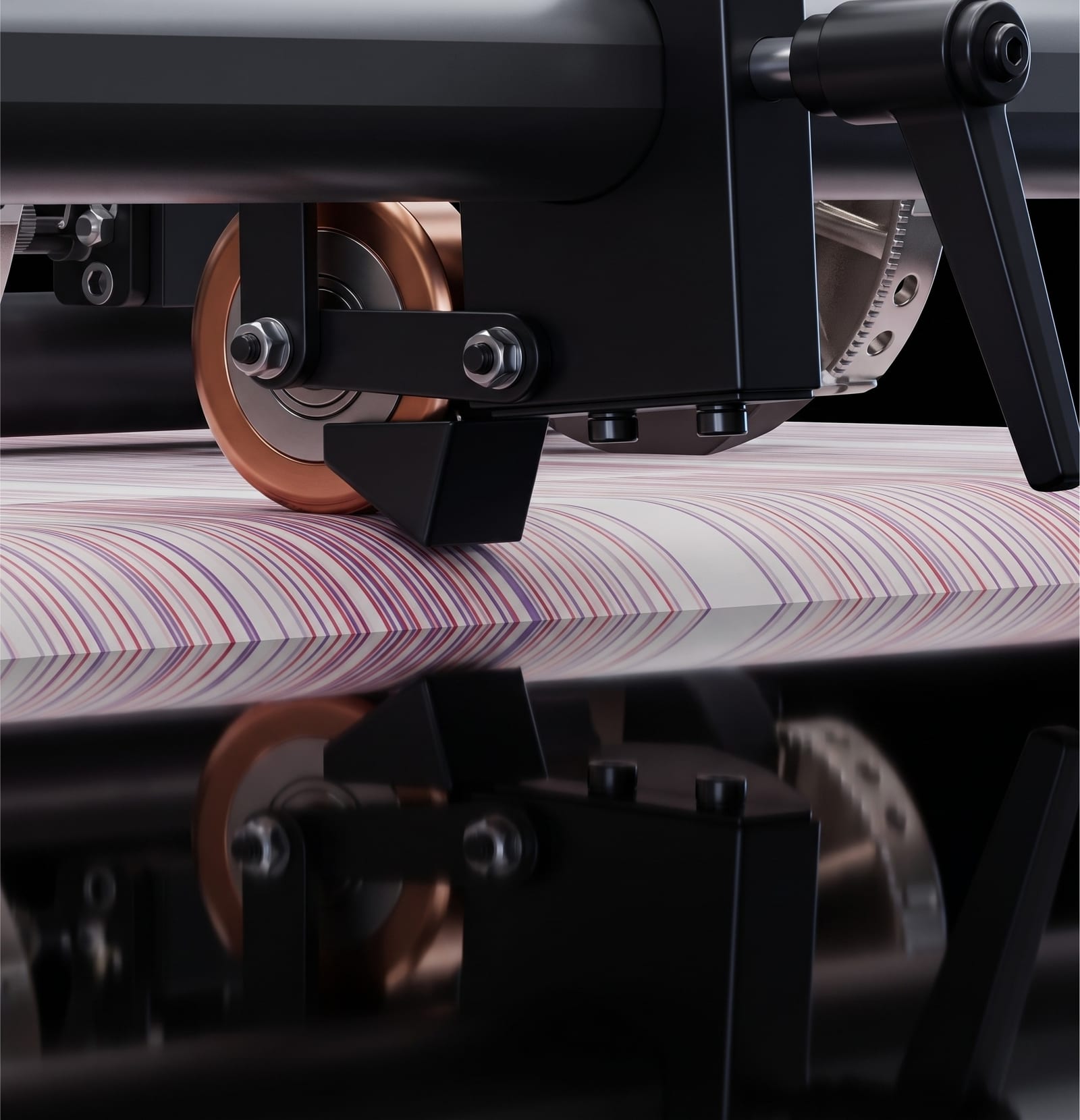 A machined wheel assembly running on the printed web